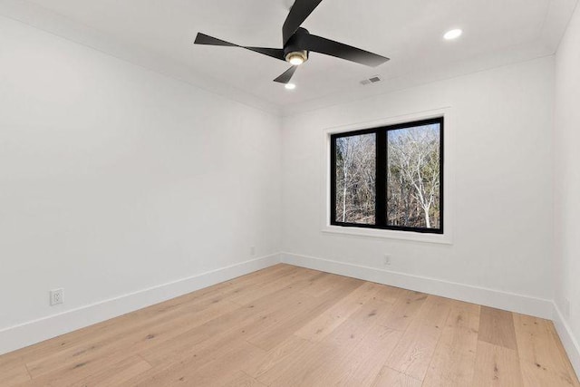 unfurnished room with ceiling fan and light hardwood / wood-style floors