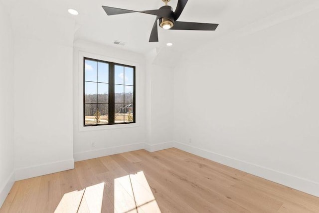 spare room featuring ceiling fan and light hardwood / wood-style flooring