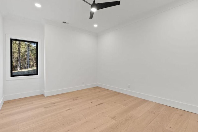 unfurnished room featuring ceiling fan and light hardwood / wood-style flooring