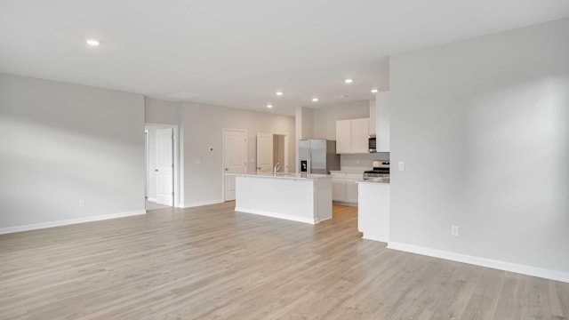 unfurnished living room with light hardwood / wood-style floors