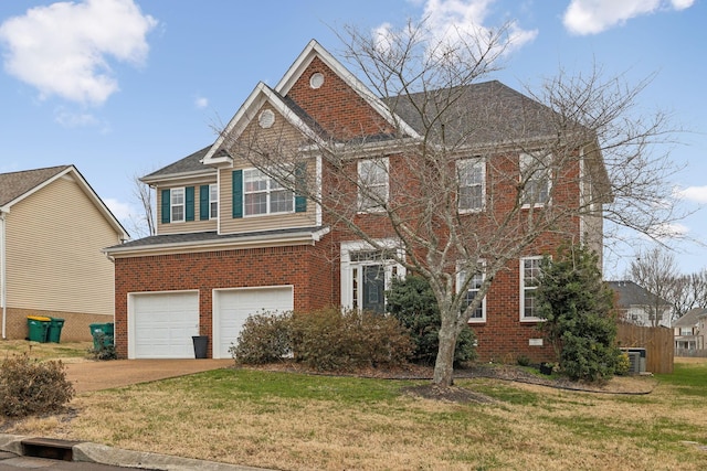 view of front facade featuring a front yard and a garage