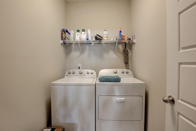 laundry room featuring washing machine and clothes dryer