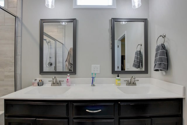 bathroom featuring vanity and an enclosed shower