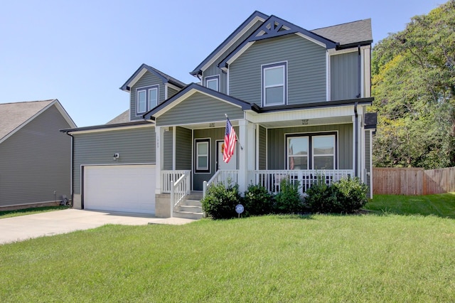 view of front facade featuring a porch, a garage, and a front lawn