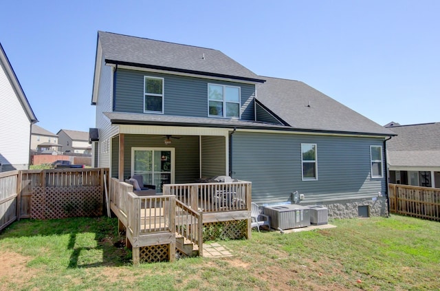 back of house with ceiling fan, a yard, cooling unit, and a deck