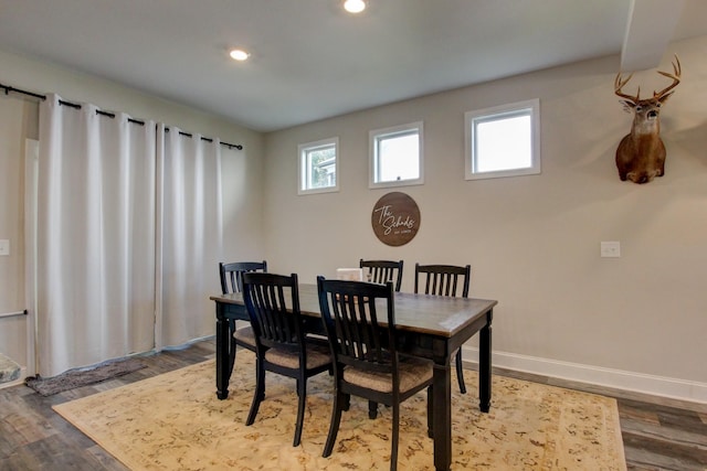 dining area featuring hardwood / wood-style floors and plenty of natural light