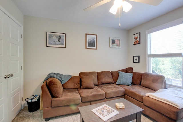 living room with light carpet and ceiling fan