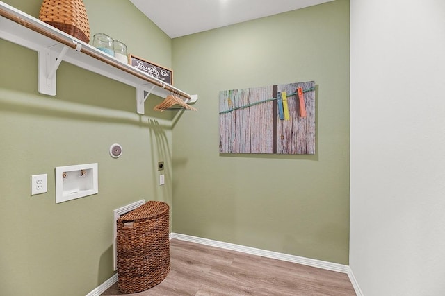 laundry area featuring hookup for an electric dryer, washer hookup, and light wood-type flooring