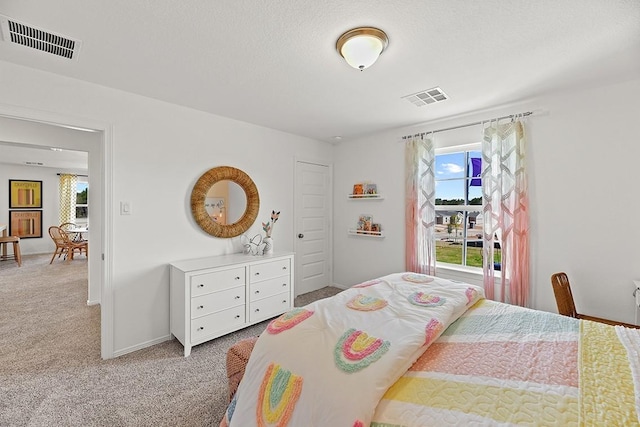 bedroom featuring light colored carpet