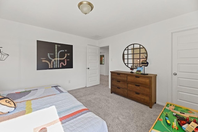 bedroom featuring light carpet