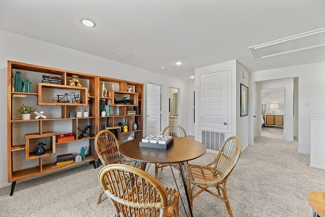 dining area with light colored carpet