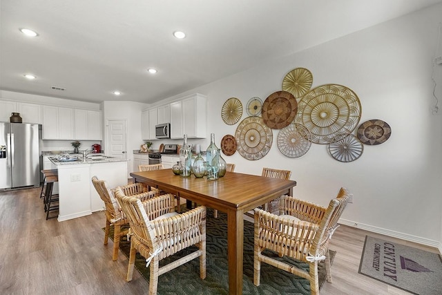 dining area featuring light hardwood / wood-style flooring