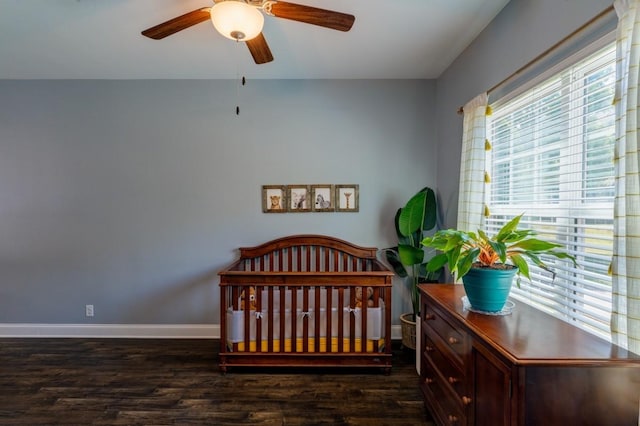 bedroom featuring ceiling fan and dark hardwood / wood-style floors