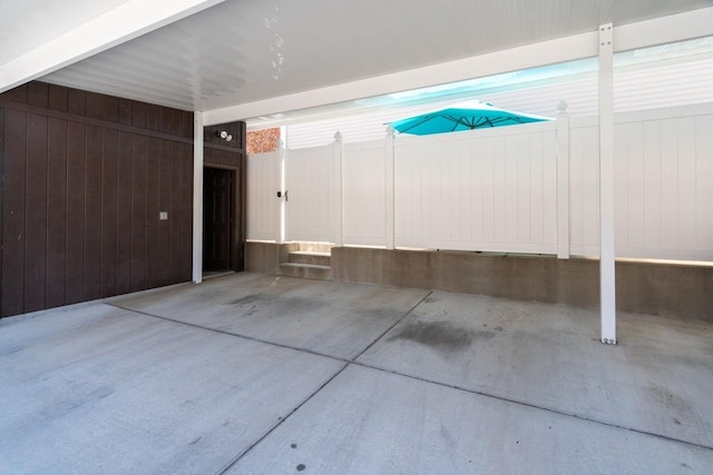 garage featuring wood walls