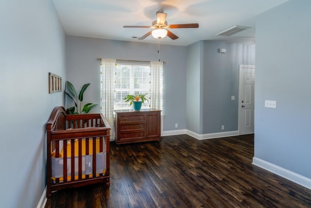 bedroom with ceiling fan and dark hardwood / wood-style floors