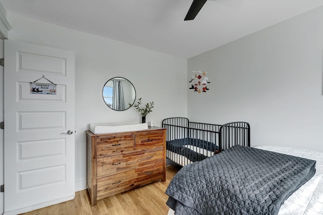 bedroom featuring ceiling fan and wood-type flooring