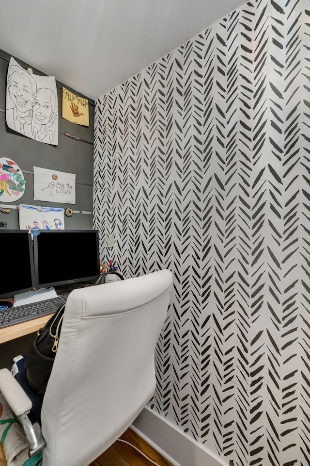 office area featuring built in desk and wood-type flooring