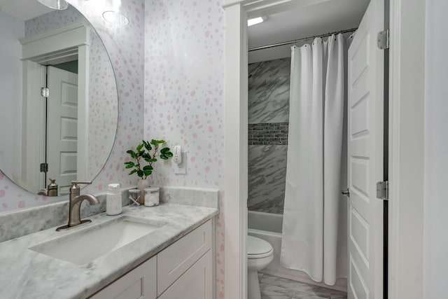 full bathroom featuring shower / bath combo, vanity, and toilet