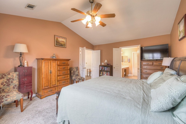 carpeted bedroom featuring connected bathroom, ceiling fan, and vaulted ceiling