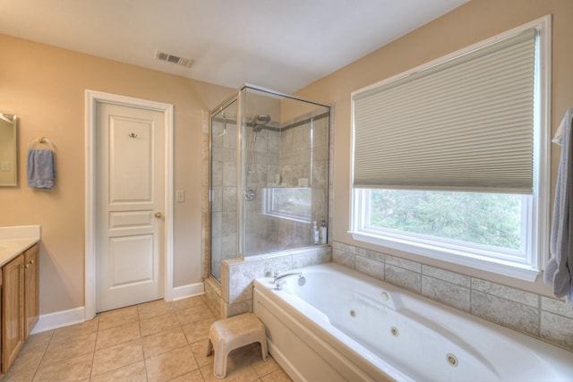 bathroom featuring vanity, tile patterned floors, and separate shower and tub