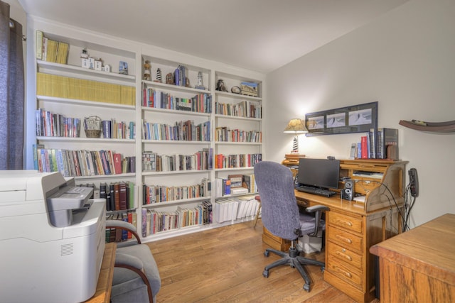 office with light hardwood / wood-style floors