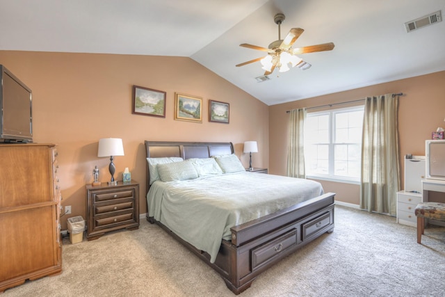 bedroom featuring light carpet, vaulted ceiling, and ceiling fan