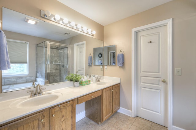 bathroom featuring tile patterned floors, vanity, and independent shower and bath