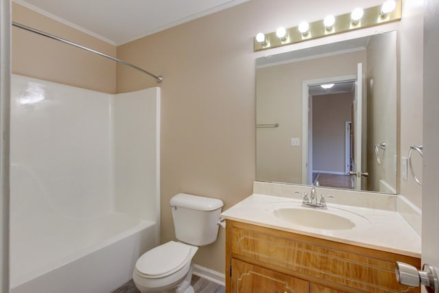 bathroom with vanity, crown molding, toilet, and bathtub / shower combination