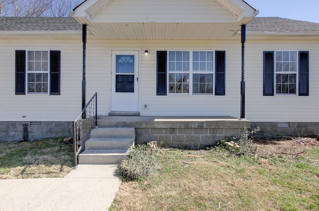 entrance to property featuring crawl space and roof with shingles