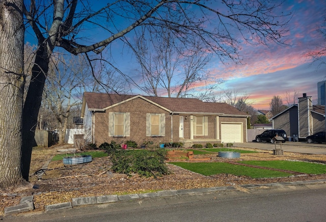 ranch-style house featuring a garage