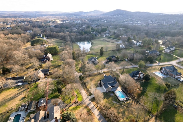 drone / aerial view featuring a residential view and a water and mountain view