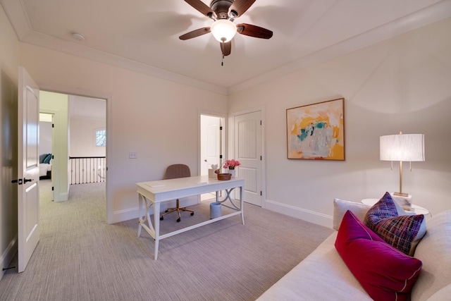 office featuring light carpet, baseboards, and crown molding