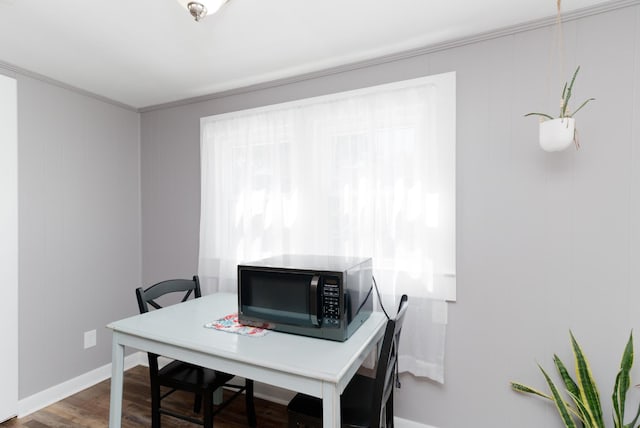 home office featuring hardwood / wood-style flooring and crown molding