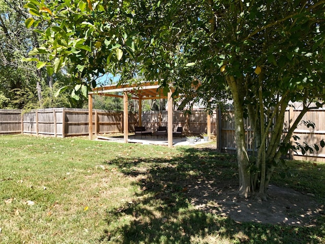 view of yard with a pergola and a patio