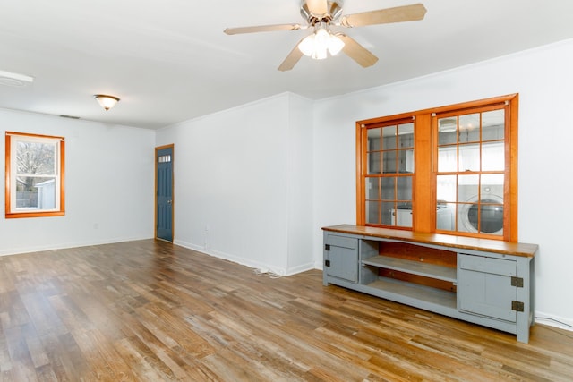 unfurnished room featuring light hardwood / wood-style flooring and ceiling fan