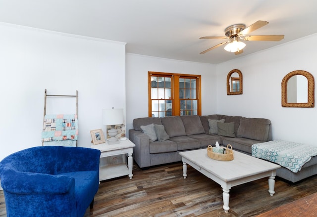 living room with french doors, crown molding, ceiling fan, and dark wood-type flooring