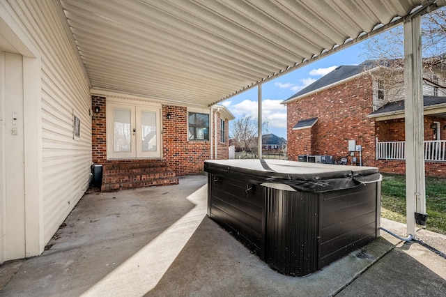 view of patio featuring french doors and a hot tub