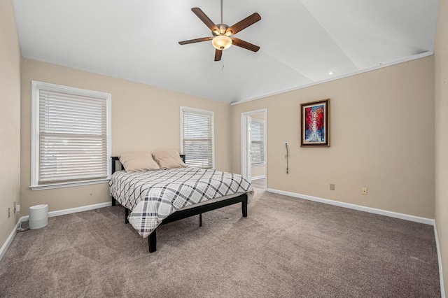 carpeted bedroom with vaulted ceiling and ceiling fan