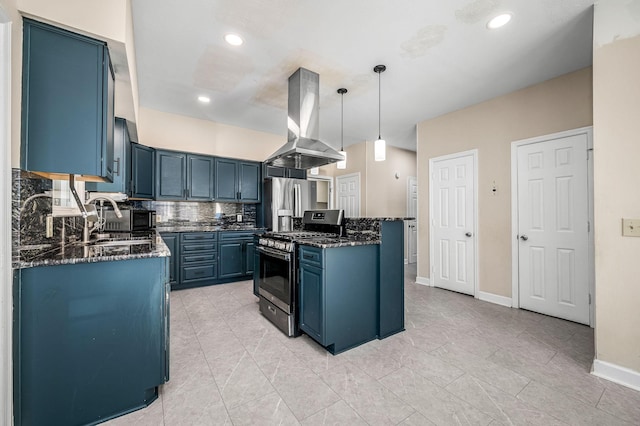 kitchen featuring stainless steel appliances, island range hood, sink, blue cabinetry, and decorative light fixtures