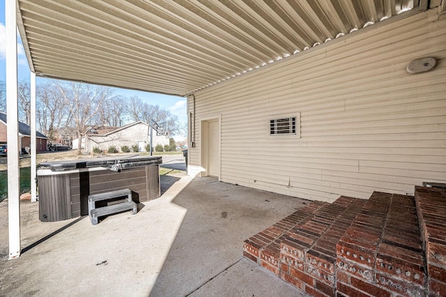 view of patio / terrace featuring a hot tub