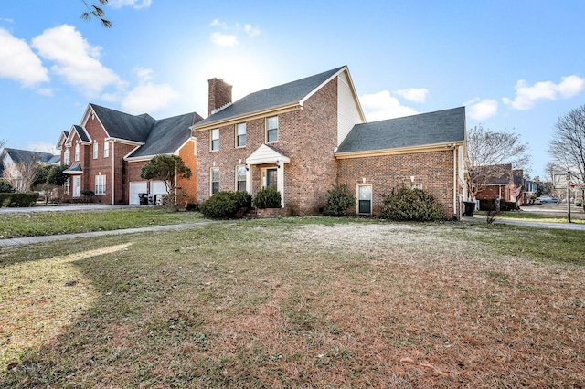 view of front of home featuring a front lawn and a garage