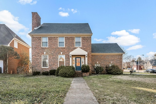 view of front of house with a front lawn