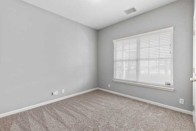 spare room featuring carpet flooring