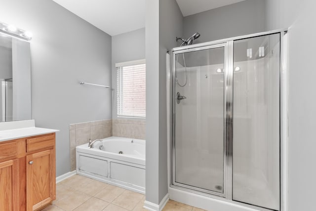 bathroom featuring tile patterned floors, separate shower and tub, and vanity