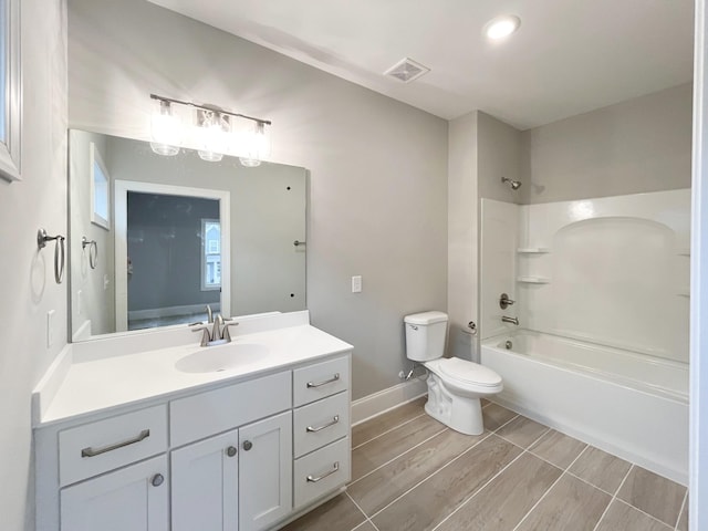 full bathroom featuring vanity, toilet, and bathing tub / shower combination