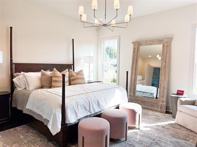 bedroom with a notable chandelier