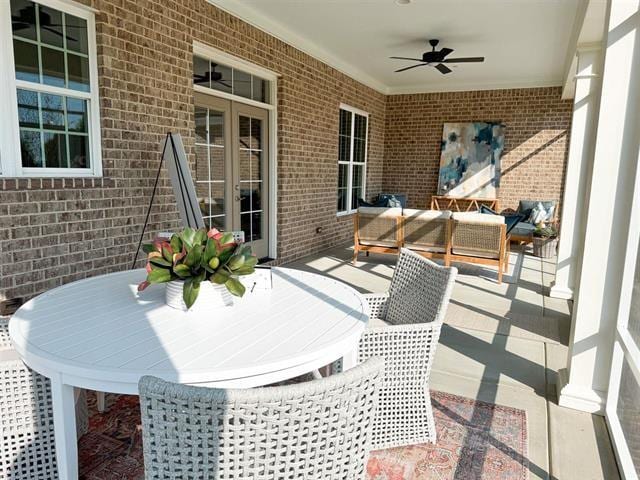 view of patio featuring an outdoor living space and ceiling fan