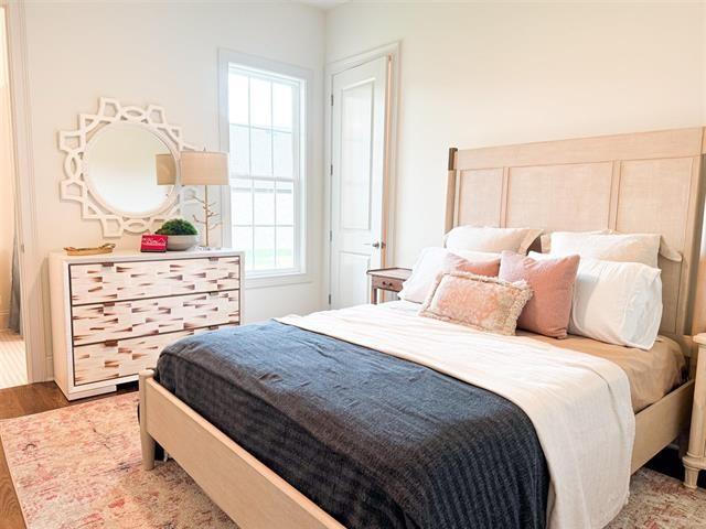 bedroom with wood-type flooring