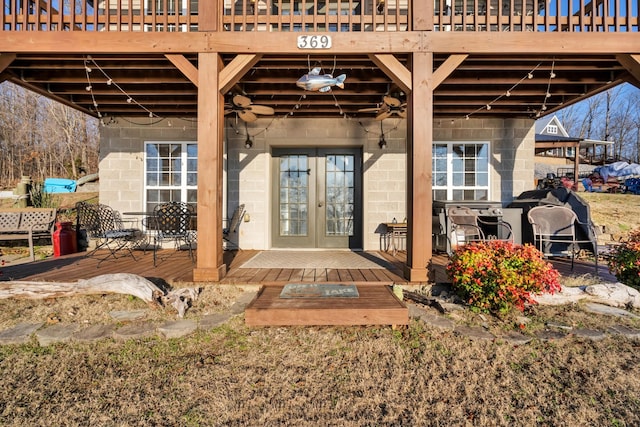 exterior space featuring a wooden deck and french doors