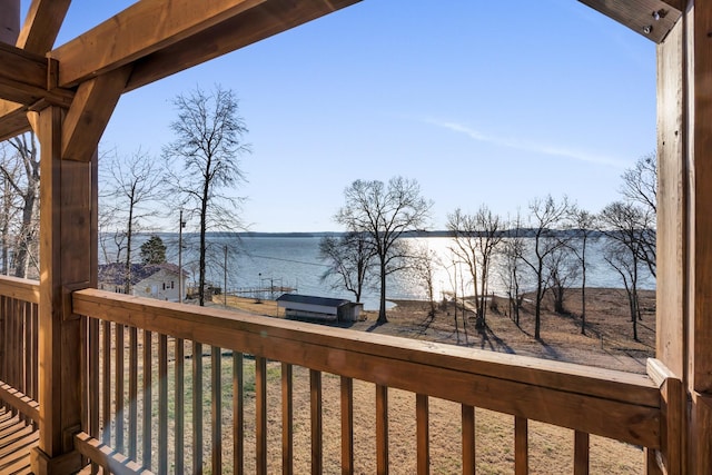 wooden terrace with a water view